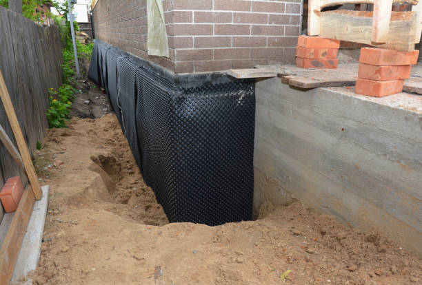 SJ Waterproofing Pros technician performing targeted Basement Waterproofing assessment in Atlantic Beach, NC